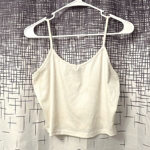 Ribbed spaghetti strap crop top in an off-white color. Perfect for layering!